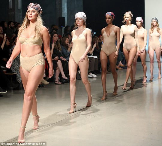 Nobody is gonna rain on their parade! Models look nearly naked as they take to the runway in VERY sheer lingerie to showcase a line of designer SHOWER CAPS